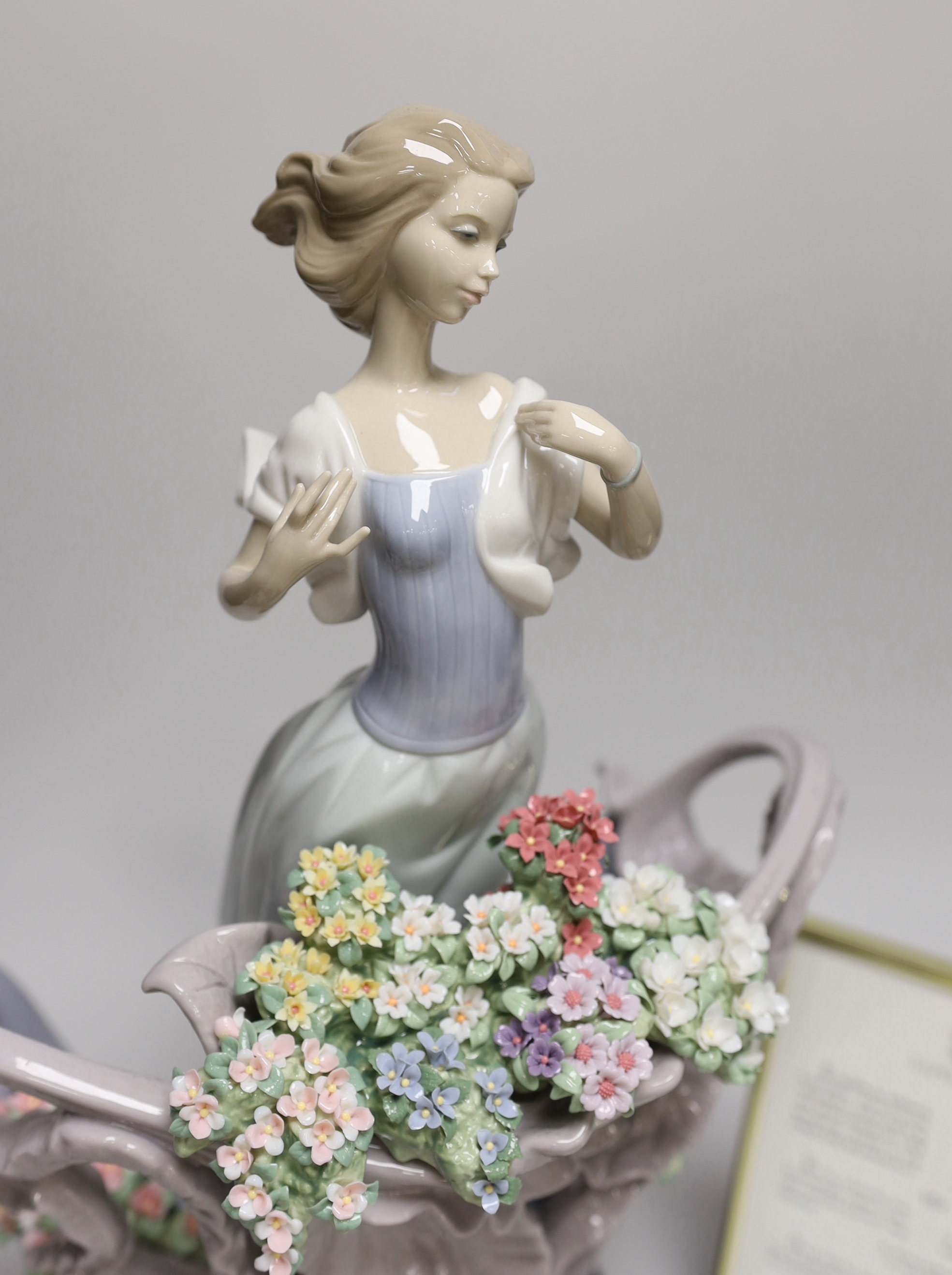 A Lladro porcelain table centrepiece, ‘’Love’s first light’’, number 01862, sculpture Joan Coderch, one of 1500, with original box and certificate, 35cm high